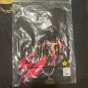 This is a black billionaire boys shirt, in the original packaging, never used.